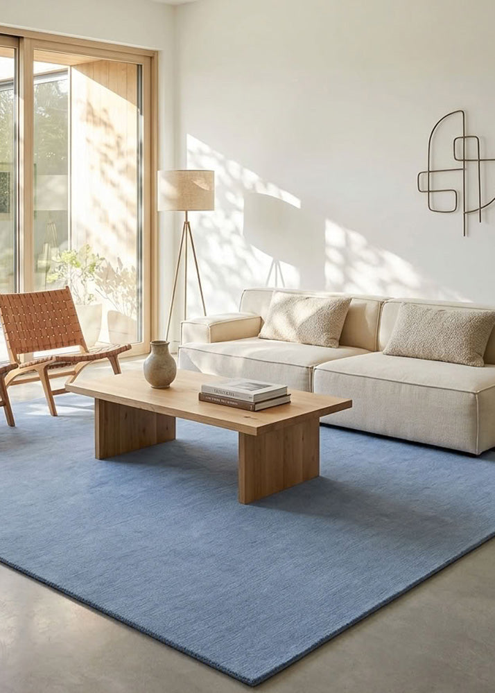 Minimalist Wool Rug in Blue Grey styled in a modern living room