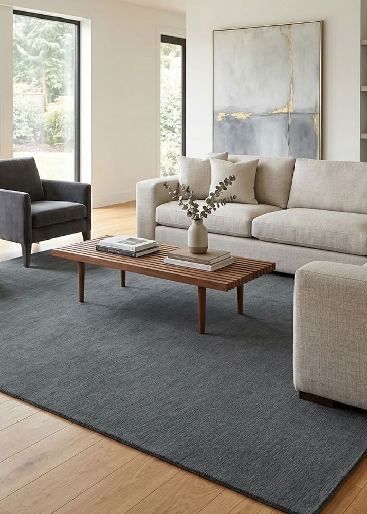 Minimalist Wool Rug in Charcoal Grey styled in a modern living room