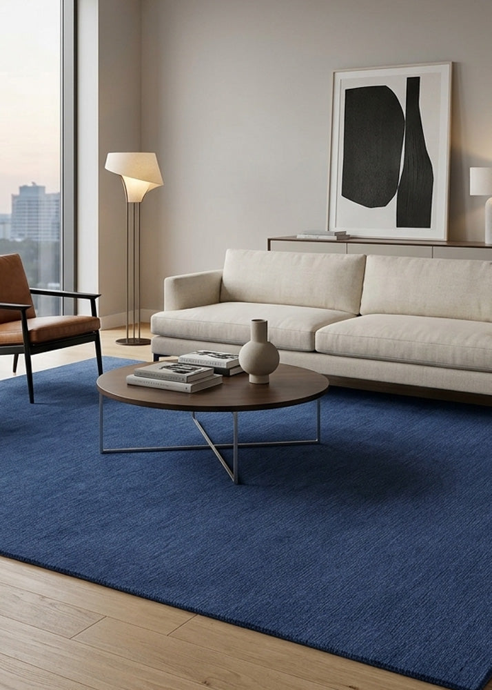Minimalist Wool Rug in Dark Blue styled in a modern living room