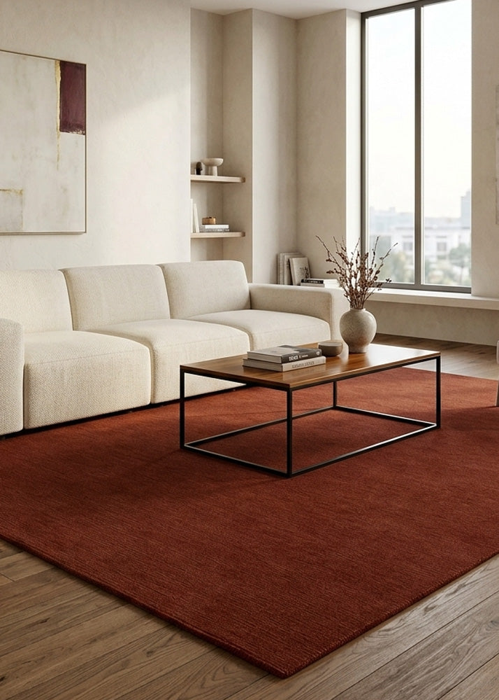 Minimalist Wool Rug in Dark Rust styled in a modern living room