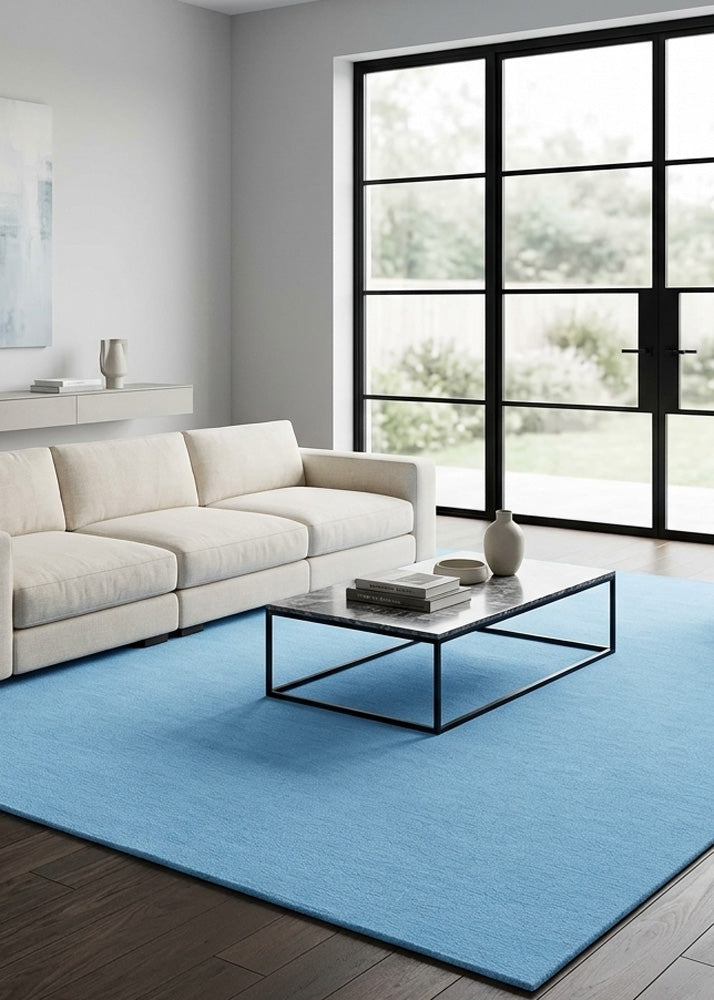 Minimalist Wool Rug in Light Blue styled in a modern living room
