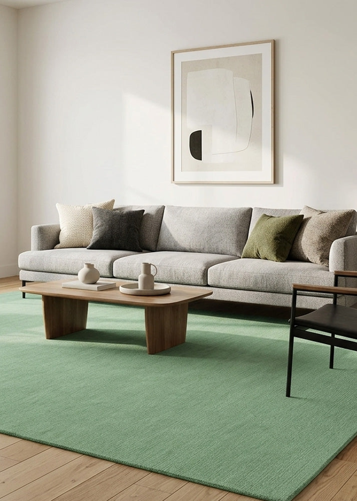 Minimalist Wool Rug in Muted Sage Green styled in a modern living room