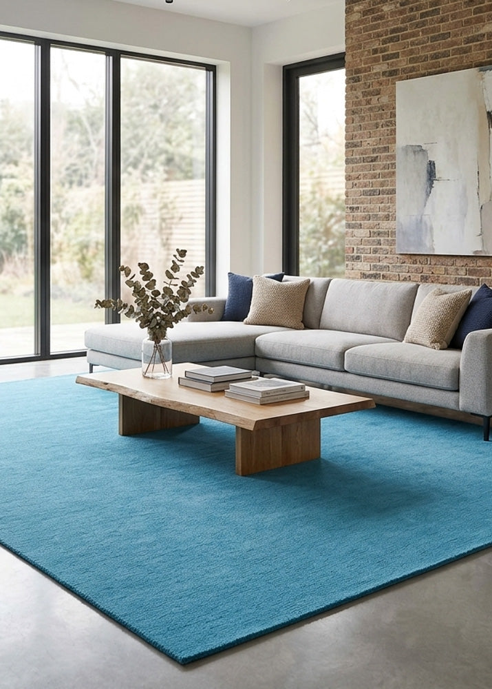 Minimalist Wool Rug in Ocean Blue styled in a modern living room
