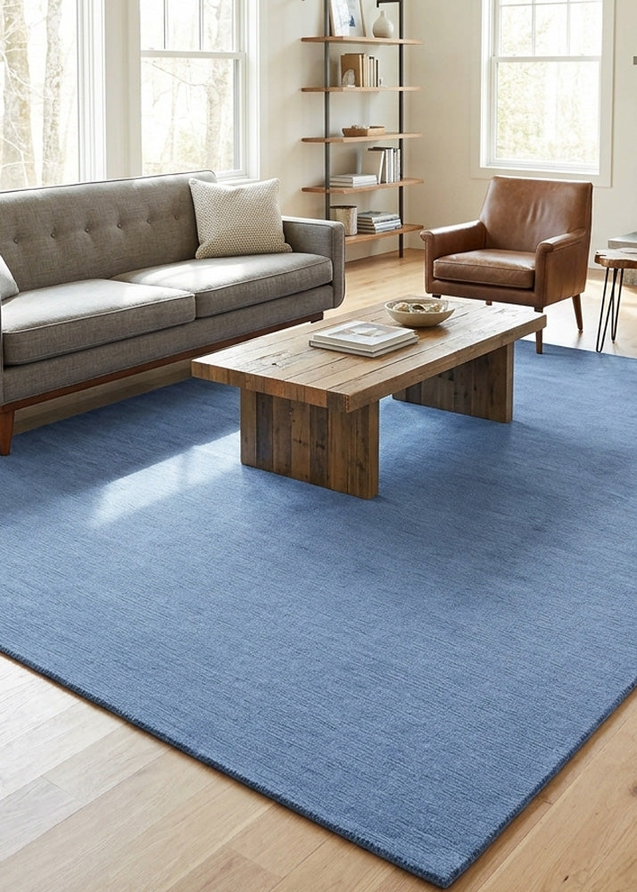 Minimalist Wool Rug in Slate Blue styled in a modern living room