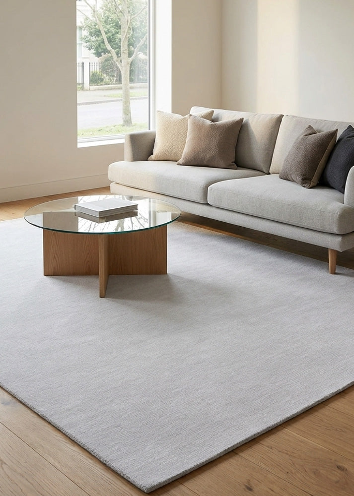 Minimalist Wool Rug in Soft Light Grey styled in a modern living room