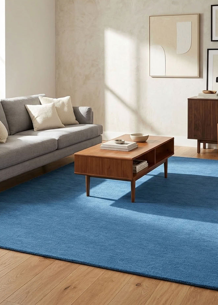 Minimalist Wool Rug in Steel Blue styled in a modern living room